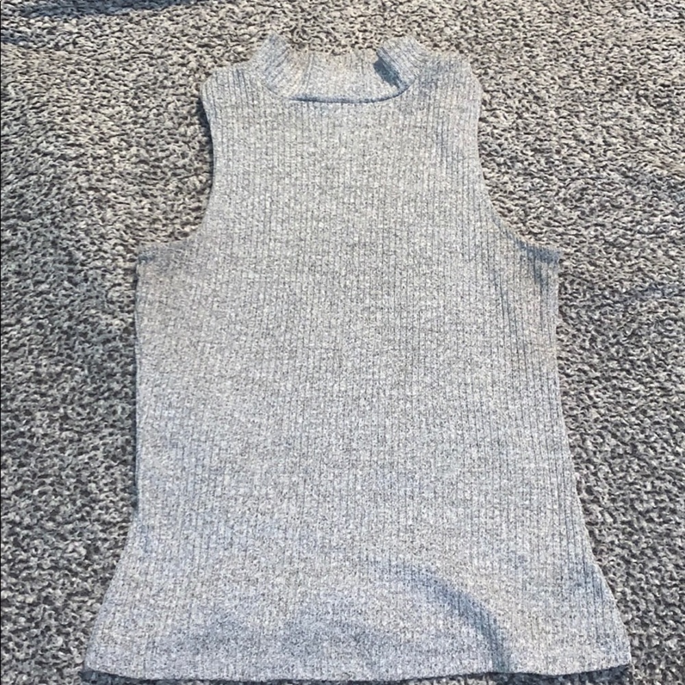 Shirt with no sleeves, bit of a turtle neck